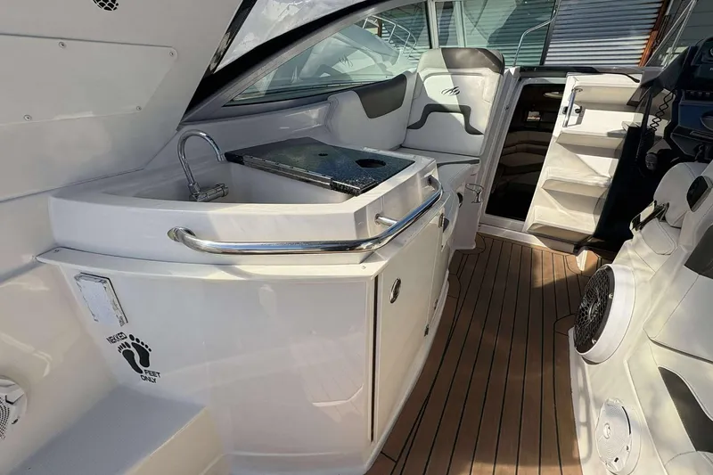Slide: The Image of 2013 Monterey 260 SCR Sport Cruiser interior with sink and seating area. - 12