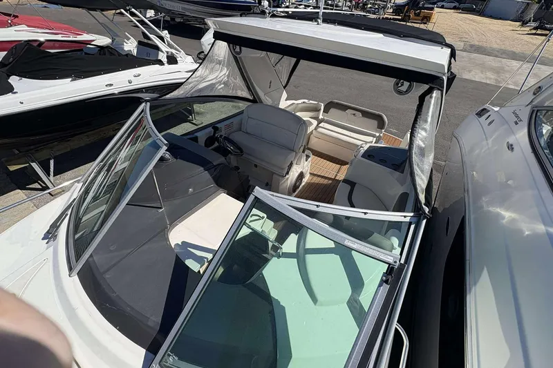 Slide: The Image of 2013 Monterey 260 SCR Sport Cruiser with open cockpit and seating area. - 17