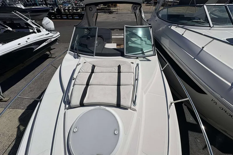 Slide: The Image of 2013 Monterey 260 SCR Sport Cruiser boat with open deck and sunbathing area. - 18