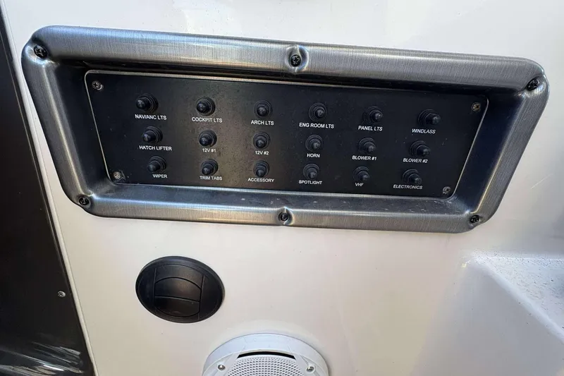 Slide: The Image of Control panel of a 2013 Monterey 260 SCR Sport Cruiser with labeled switches. - 22