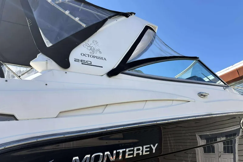 Slide: The Image of 2013 Monterey 260 SCR Sport Cruiser boat with sleek design and clear canopy. - 3