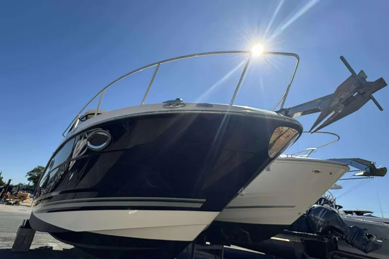 Slide: The Image of 2013 Monterey 260 SCR Sport Cruiser under bright blue sky. - 4