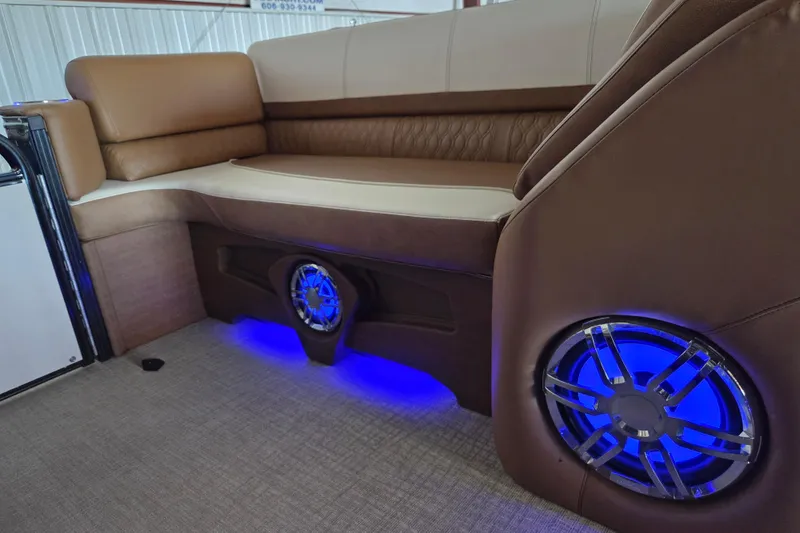 Slide: The Image of Luxurious seating with blue LED speakers in 2023 Avalon Platinum 2385 Catalina Quad Lounger. - 14