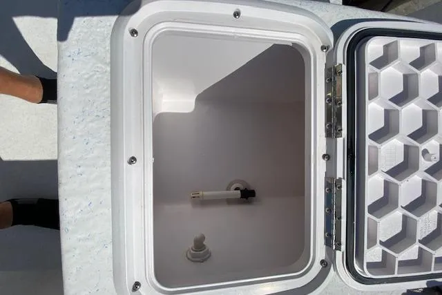Slide: The Image of Open storage compartment on a 2009 PRO LITE 20 CC boat. - 10