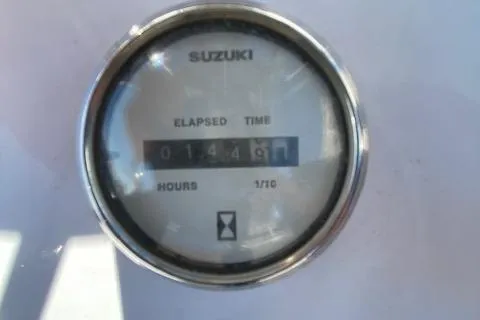 Slide: The Image of Close-up of a Suzuki elapsed time gauge showing 1449.1 hours on a 2009 PRO LITE 20 CC. - 11