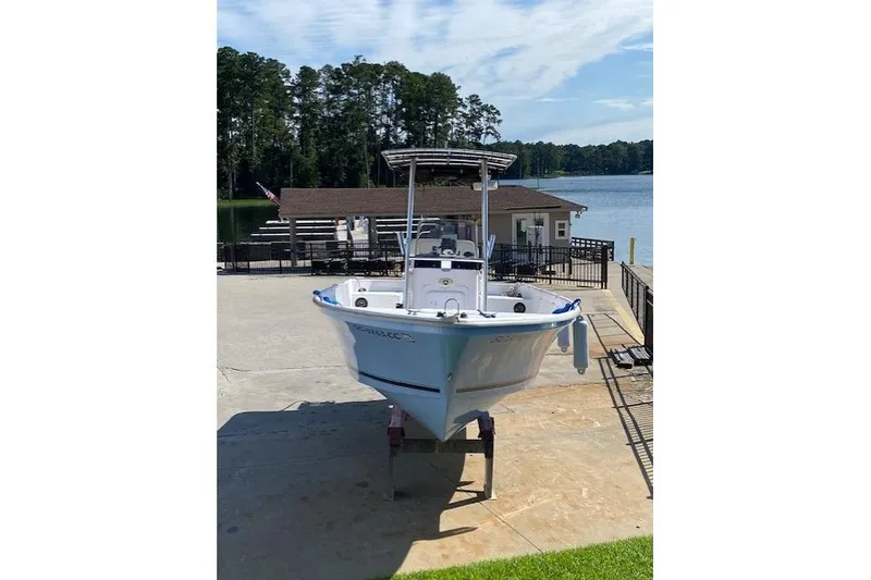 Slide: The Image of 2009 PRO LITE 20 CC boat on dock by lake with trees in background. - 3