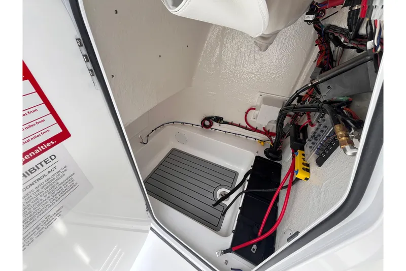 Slide: The Image of Interior view of 2026 Tidewater 2210 Carolina Bay boat wiring and components. - 13