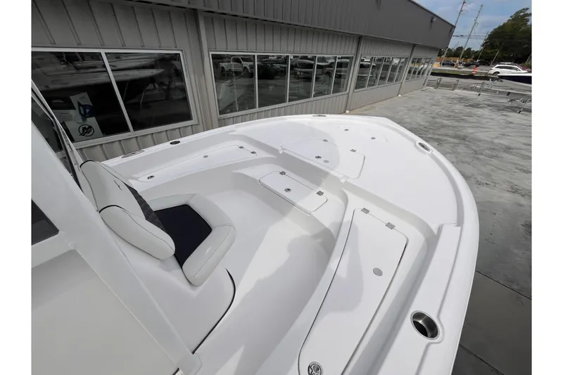 Slide: The Image of 2026 Tidewater 2210 Carolina Bay boat with spacious seating and storage compartments. - 6