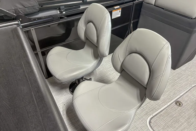 Slide: The Image of 2025 Trifecta 24 E CS boat interior with two modern gray seats. - 7