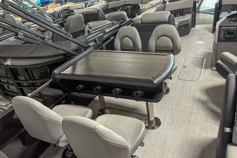 Slide: The Image of 2025 Trifecta 24 E CS boat interior with sleek seating and modern table design. - 8