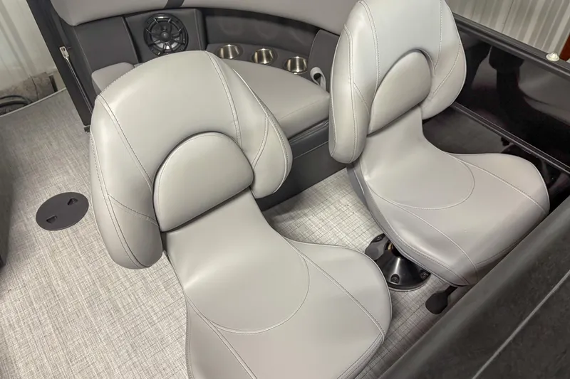 Slide: The Image of 2025 Trifecta 24 E CS boat interior with sleek gray seating and modern design. - 9