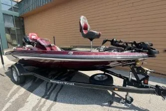The Image of 2020 Ranger Z175 boat on trailer, maroon color, parked outdoors. - 1