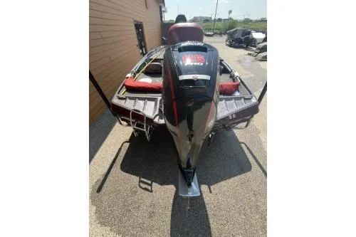 Slide: The Image of 2020 Ranger Z175 boat parked outdoors, rear view with motor and red seats. - 3
