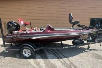 Slide: The Image of 2020 Ranger Z175 boat on trailer, maroon color, parked outdoors. - 4