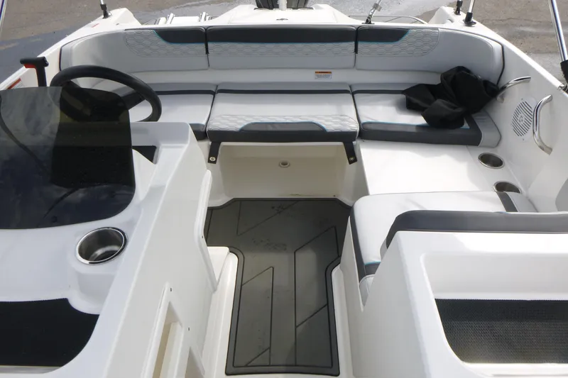 Slide: The Image of 2022 Bayliner Element M17 boat interior with seating and steering wheel. - 11