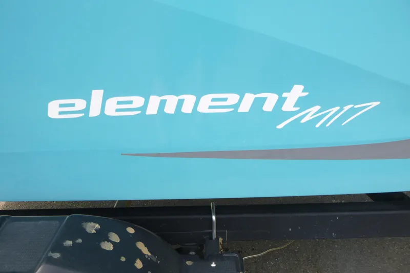 Slide: The Image of 2022 Bayliner Element M17 boat logo on a blue hull. - 14