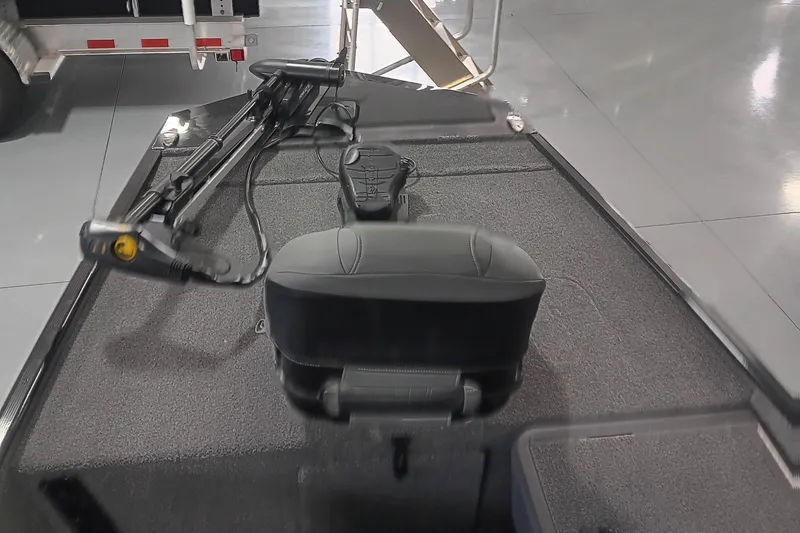 Slide: The Image of 2025 Tracker Bass Tracker Classic XL boat interior with trolling motor and seat. - 10