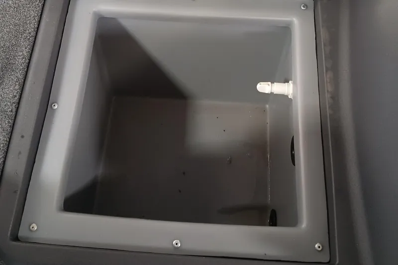 Slide: The Image of 2025 Tracker Bass Tracker Classic XL livewell interior with drain plug. - 11