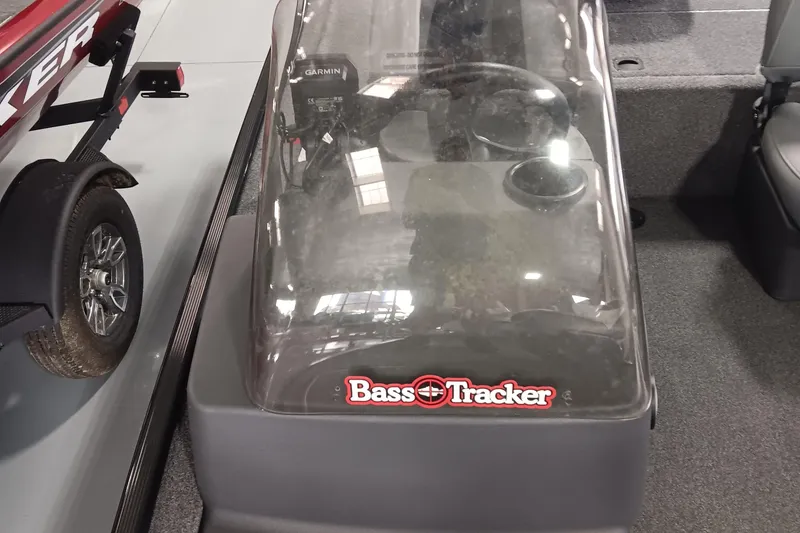 Slide: The Image of 2025 Tracker Bass Tracker Classic XL boat console with Garmin electronics and cup holders. - 13