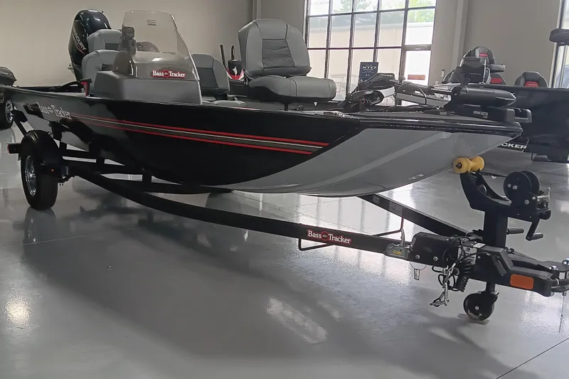 Slide: The Image of 2025 Tracker Bass Tracker Classic XL boat on trailer in showroom. - 6