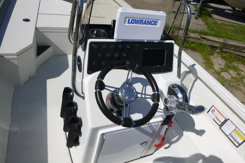 Slide: The Image of 2025 Ranger RB210 boat console with steering wheel and Lowrance Elite display. - 14