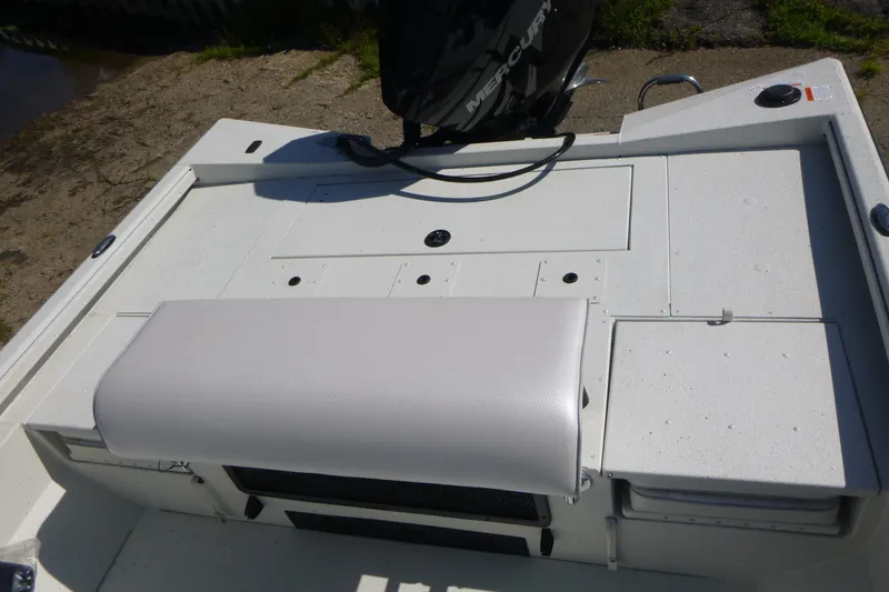 Slide: The Image of 2025 Ranger RB210 boat deck with Mercury engine, featuring a white cushioned seat. - 15