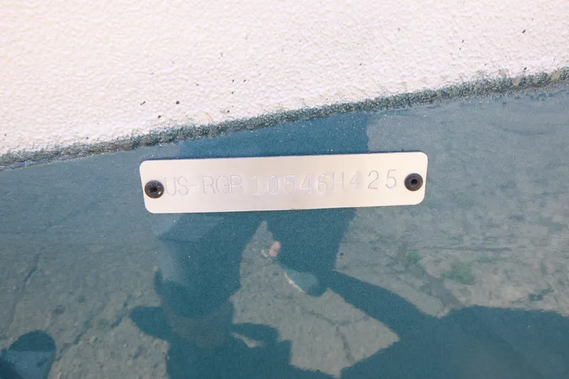 Slide: The Image of Ranger RB210 2025 model identification plate with serial number on a textured surface. - 19