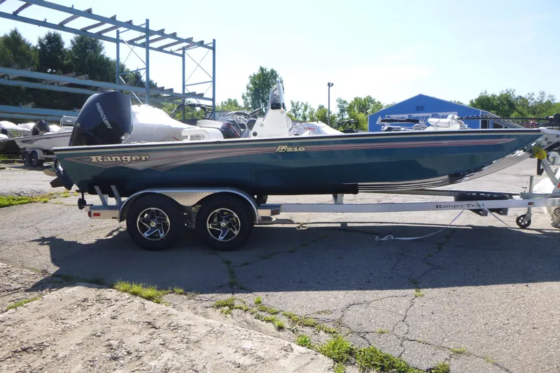Slide: The Image of 2025 Ranger RB210 boat on trailer in outdoor setting. - 4