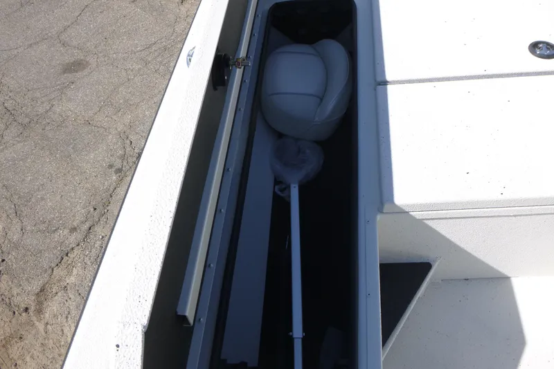 Slide: The Image of 2025 Ranger RB210 boat storage compartment with seat and equipment. - 9