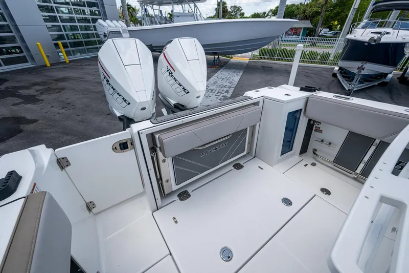 Slide: The Image of 2019 Blackfin 272 CC boat with dual outboard engines, spacious deck, and modern design. - 12
