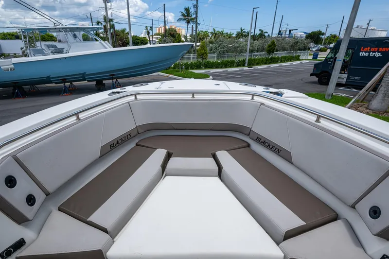 Slide: The Image of 2019 Blackfin 272 CC boat interior with cushioned seating and sleek design. - 28