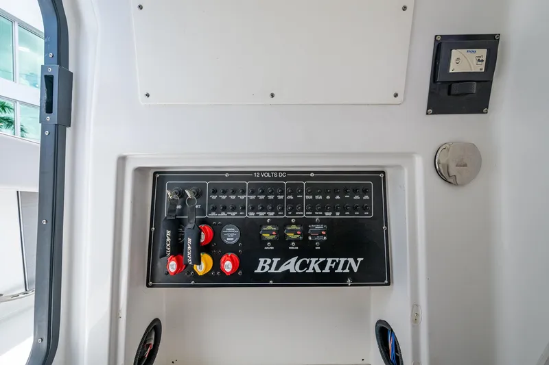Slide: The Image of Control panel of a 2019 Blackfin 272 CC boat with switches and levers. - 30