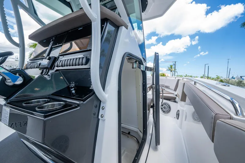 Slide: The Image of 2019 Blackfin 272 CC boat interior with helm station and seating area. - 31