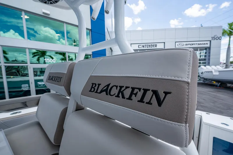 Slide: The Image of 2019 Blackfin 272 CC boat seats with logo, dealership background. - 32
