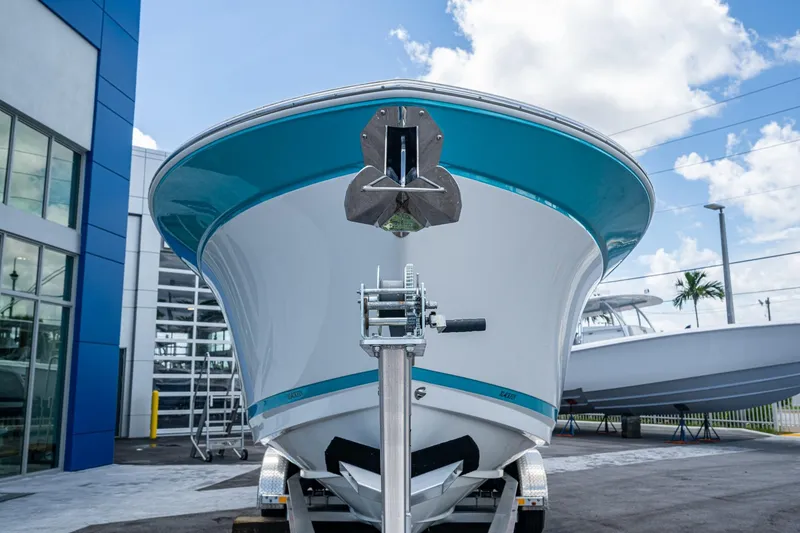 Slide: The Image of 2019 Blackfin 272 CC boat on trailer, displayed outdoors under blue sky. - 4
