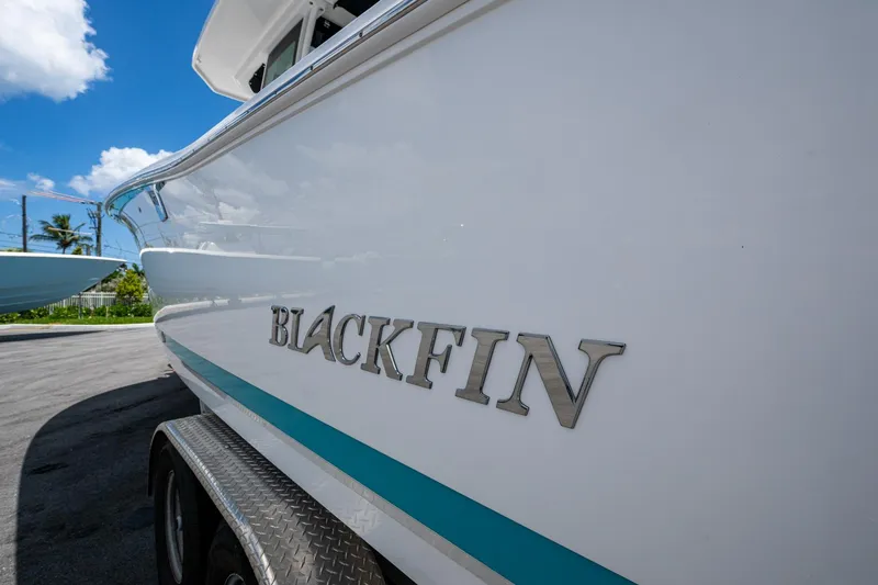 Slide: The Image of 2019 Blackfin 272 CC boat on trailer, sunny day, clear sky. - 47