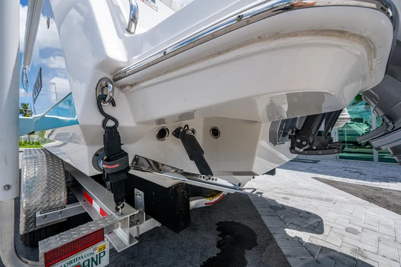 Slide: The Image of 2019 Blackfin 272 CC boat on trailer, rear view with Mercury engine. - 48