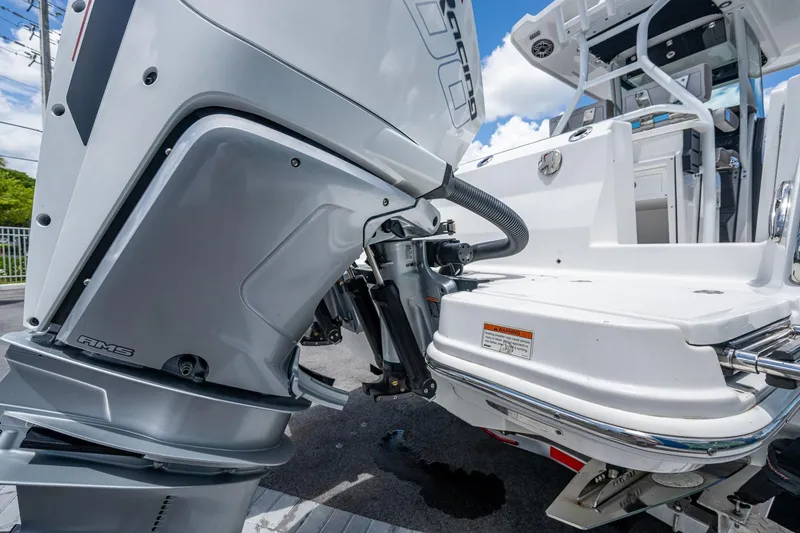Slide: The Image of 2019 Blackfin 272 CC boat with powerful outboard motor, showcasing sleek design and engineering. - 51