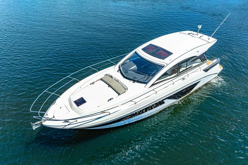 Slide: The Image of 2024 Beneteau Gran Turismo 45 yacht cruising on open water. - 4