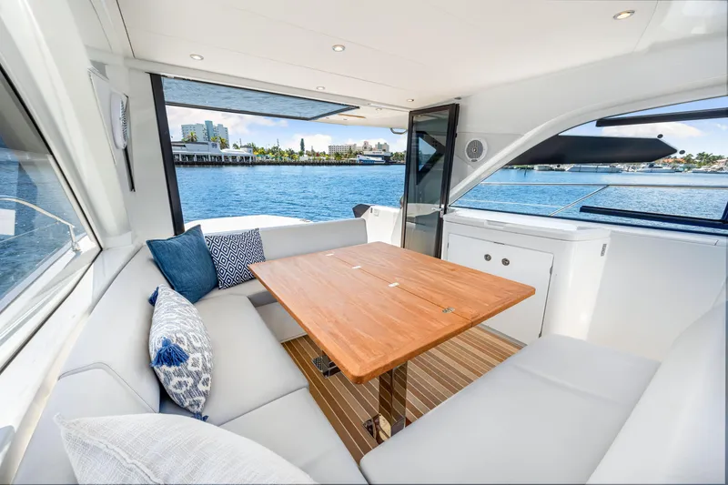 Slide: The Image of Luxurious interior of 2024 Beneteau Gran Turismo 45 yacht with waterfront view. - 50