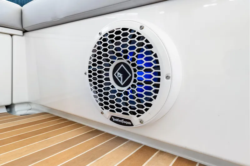 Slide: The Image of 2024 Beneteau Gran Turismo 45 boat speaker with blue LED lighting on deck. - 57