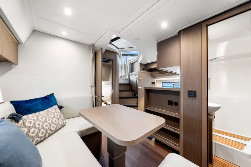 Slide: The Image of Luxurious interior of 2024 Beneteau Gran Turismo 45 yacht, featuring modern seating and elegant wood finishes. - 63
