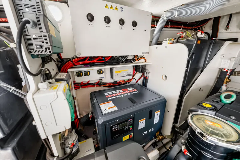 Slide: The Image of Engine room of 2024 Beneteau Gran Turismo 45 yacht, featuring advanced electrical systems. - 75