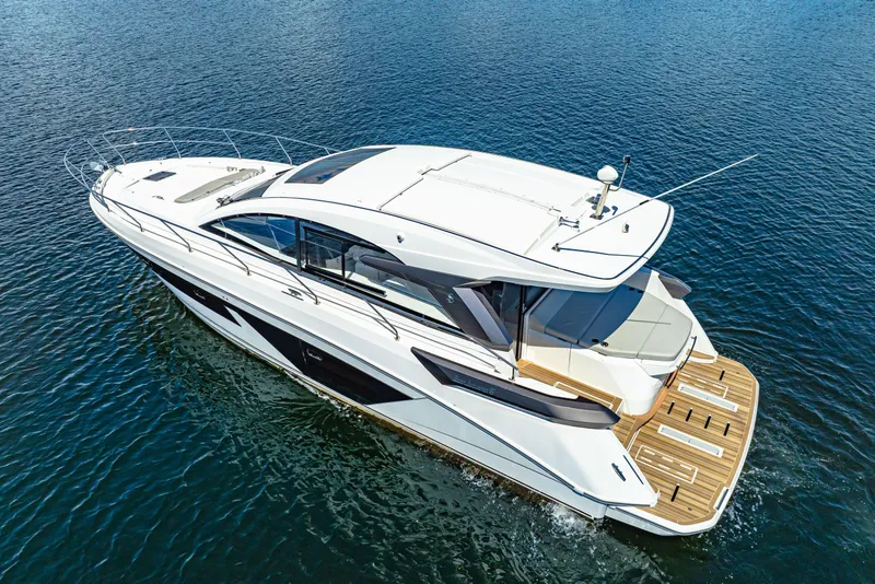 Slide: The Image of 2024 Beneteau Gran Turismo 45 yacht cruising on open water, showcasing sleek design. - 8