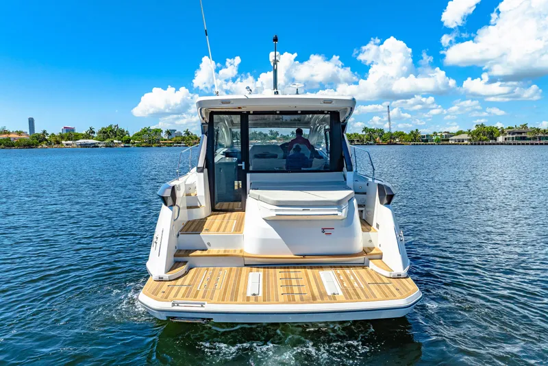 Slide: The Image of 2024 Beneteau Gran Turismo 45 yacht on water, rear view, sunny day. - 9