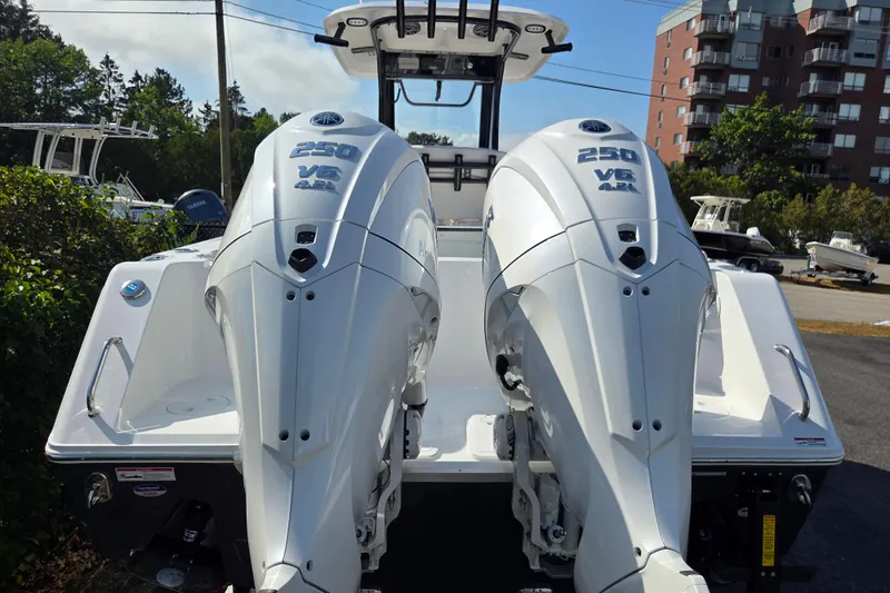 Slide: The Image of 2026 Sea Hunt Gamefish 27 with twin 250 V6 engines, docked outdoors. - 4