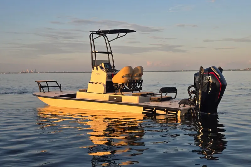 Slide: The Image of 2025 SCB R24 boat on calm water at sunset. - 3