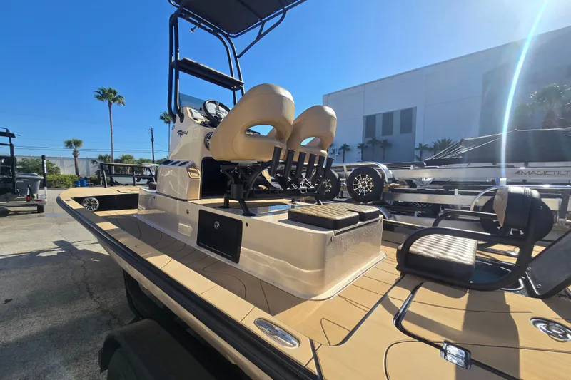 Slide: The Image of 2025 SCB R24 boat with sleek design, parked outdoors under clear blue sky. - 6