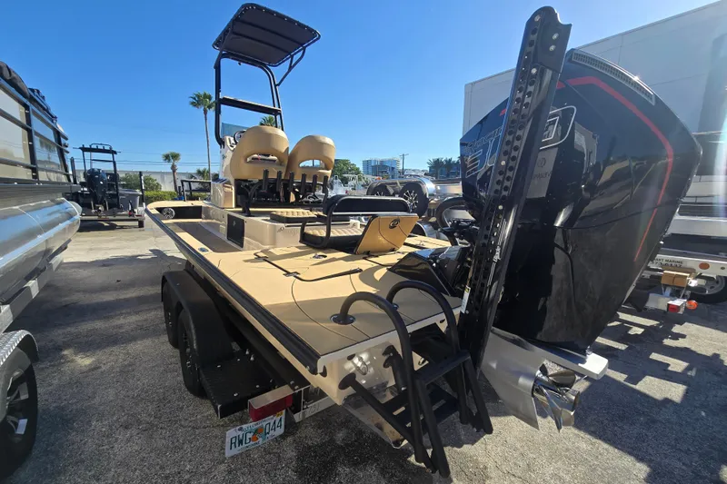 Slide: The Image of 2025 SCB R24 boat with powerful engine, dual seats, and sleek design on a trailer. - 7