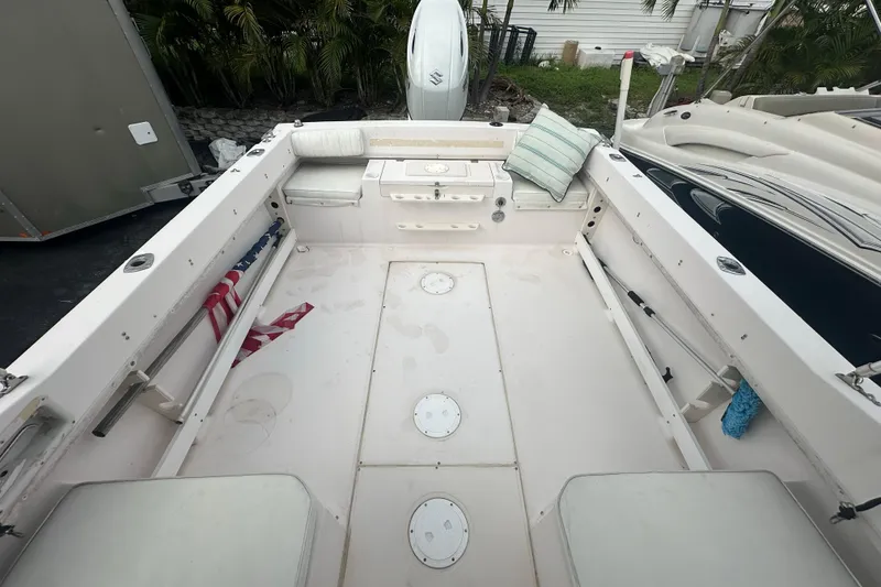 Slide: The Image of 1998 Grady-White Tournament 223 boat interior with seating and storage compartments. - 10